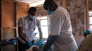 Doctors treating a child in Shinkafi hospital